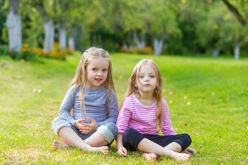 Two Cute Girls Playing in the Par Stock Photo - Image of leisure ...