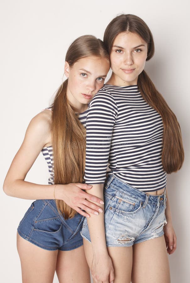 Two Cute Teenagers Having Fun Together Isolated On Stock Photo Image