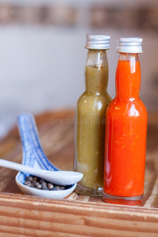 Two Different Hot Sauces, Salt and Pepper Stock Photo Image of pepper