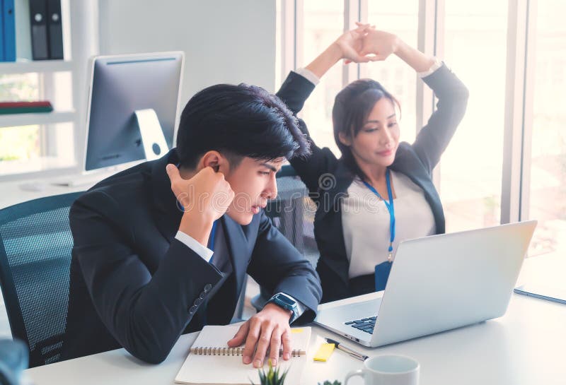 Two disappointed Business person looking at computer screen with upset and tired faces for business failure concept stock photos