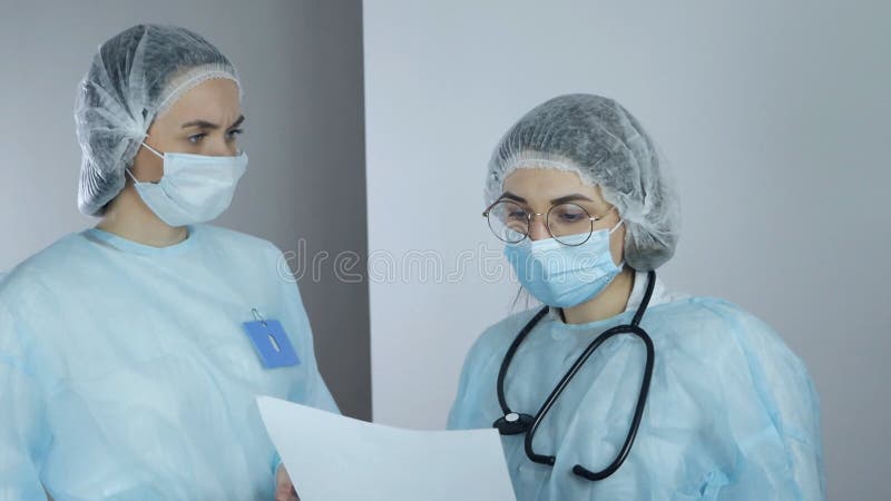 Two doctors discussing results of the analysis