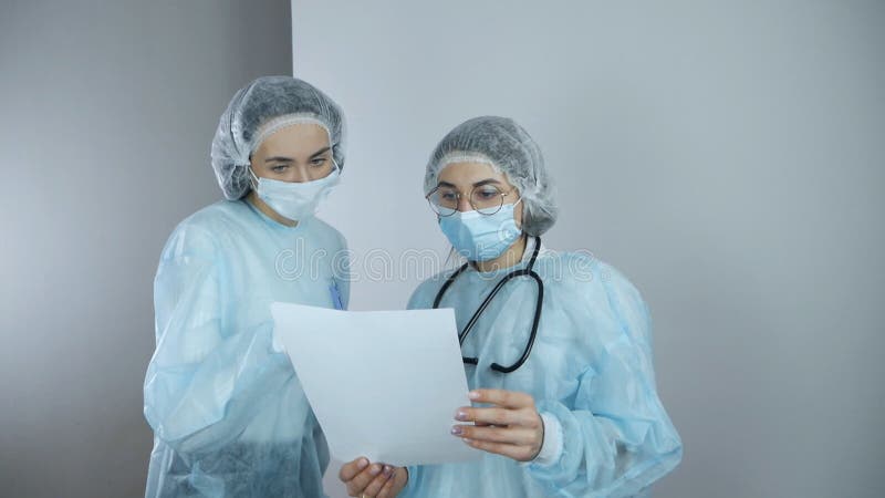 Two doctors discussing results of the analysis