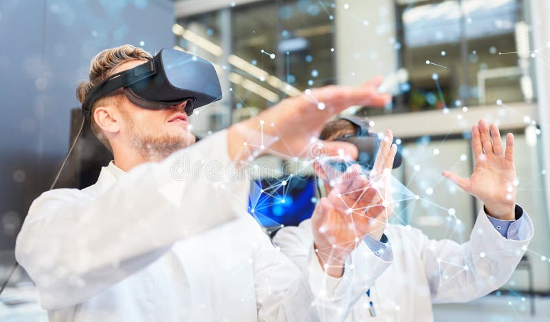 Two doctors with virtual reality glasses in training stock image