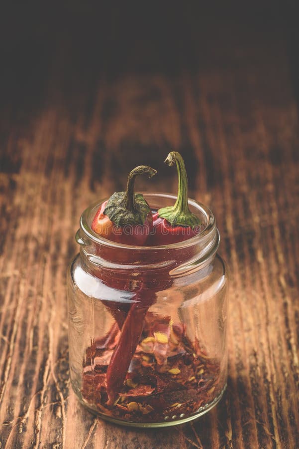 Two Dried Red Chili Peppers in Jar Stock Photo Image of mexican, grinding 194318896