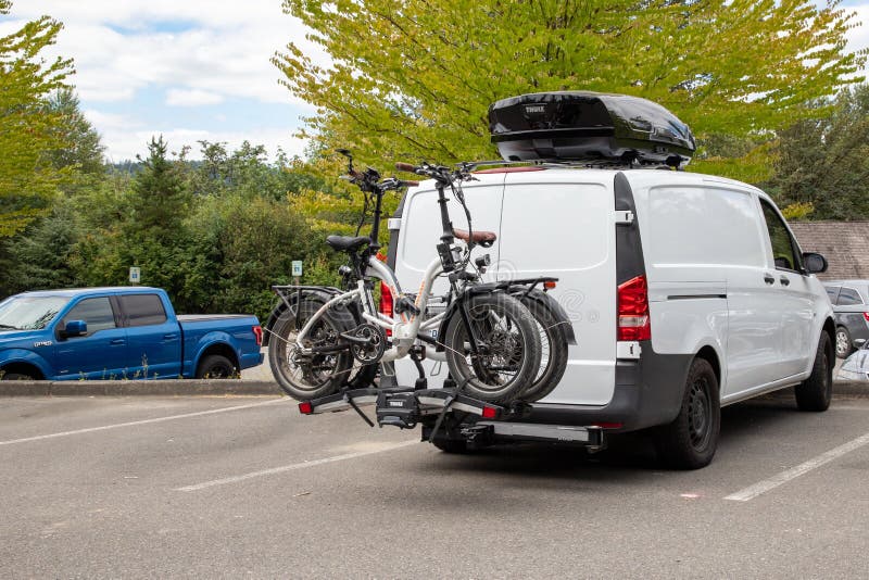 Two EBikes on Bicycle Rack on Back of Van Editorial Image Image of