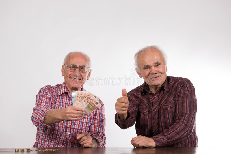 Two men with euro notes s in their hands