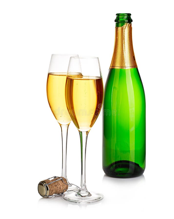 Two elegant champagne glasses on the background of green bottles close-up isolated on a white. Festive still life.