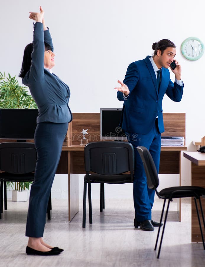 Two Employees Doing Sport Exercises in the Office Stock Image Image