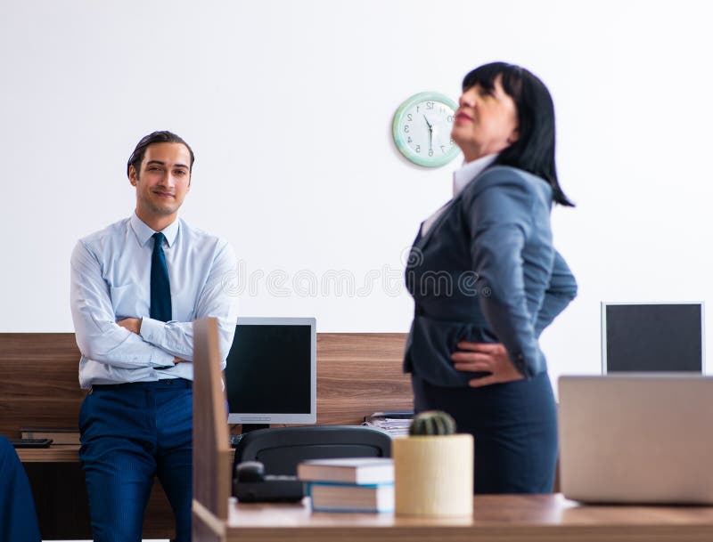 Two Employees Doing Sport Exercises in the Office Stock Image Image