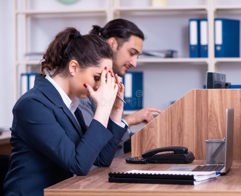 Two employees working in the office stock photography