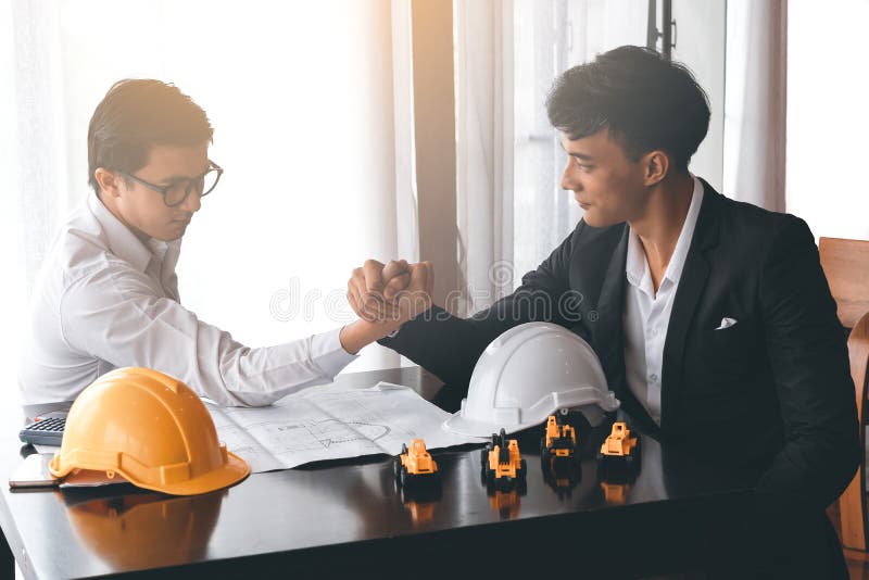 Two engineer or businessman engage in arm wrestling royalty free stock photography Two engineer or businessman engage in arm wrestling royalty free stock photography