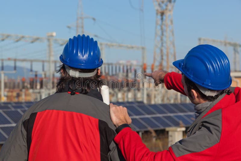 Two Engineers at Work stock image. Image of outdoors - 18393779