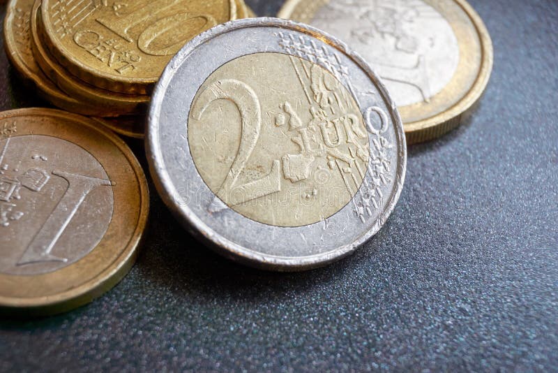 Two Euro Coin In Front Of Different Other Euro Coins Stock Image ...