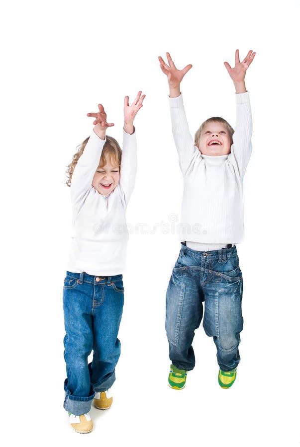 Two excited kids jumping up isolated on white