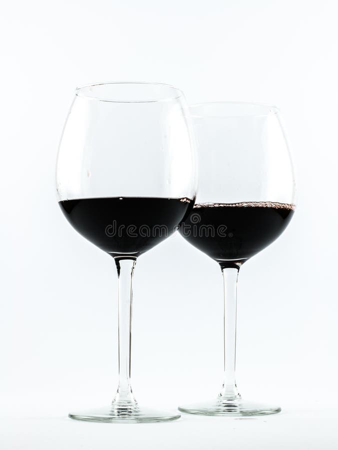 Two Exquisite Transparent Glasses With Red Wine On A White Background