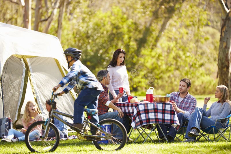 Two Families Enjoying Camping Holiday In Countryside royalty free stock images Two Families Enjoying Camping Holiday In Countryside royalty free stock images