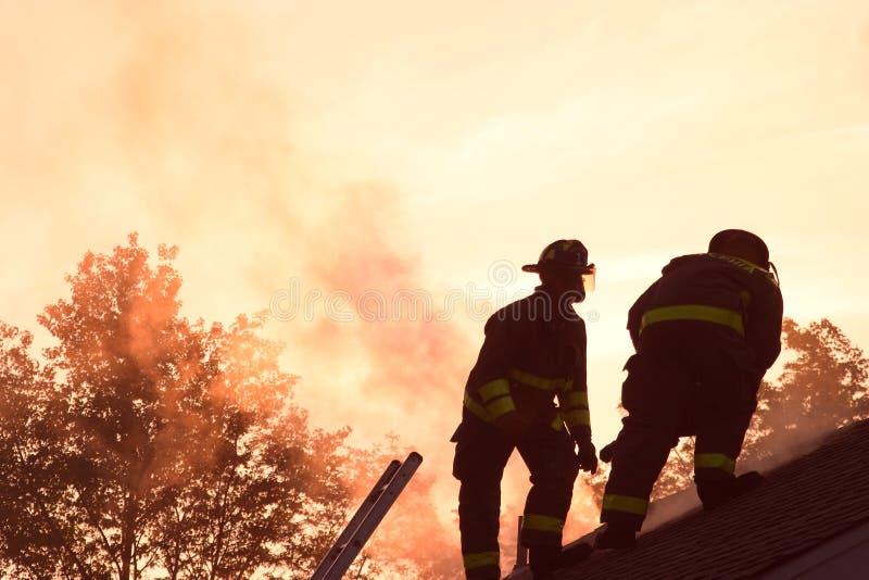 Two firefighters fighting a fire