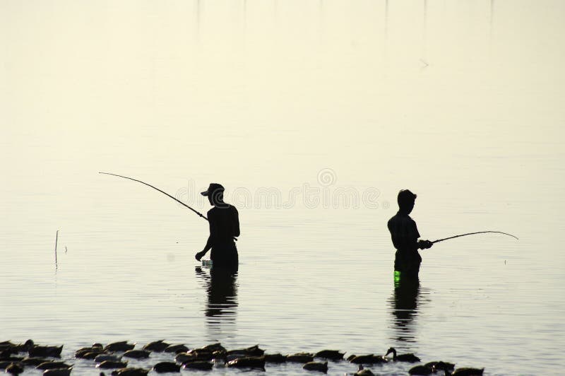 Two fisherman silhouette.