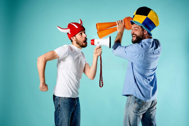The two football fans with mouthpiece over blue