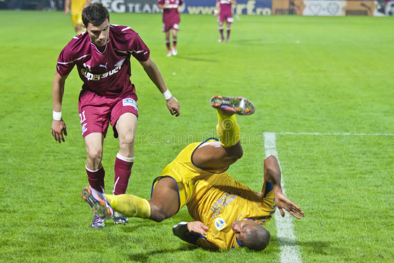 Two Football Players Fighting For The Ball Editorial Stock Photo