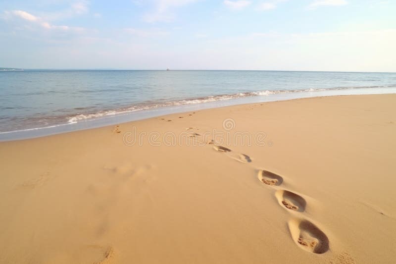 two footprints, one large and one small, on a sandy beach, created with generative ai AI generated