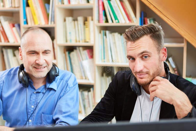 Two freelancers as competent software developers stock images