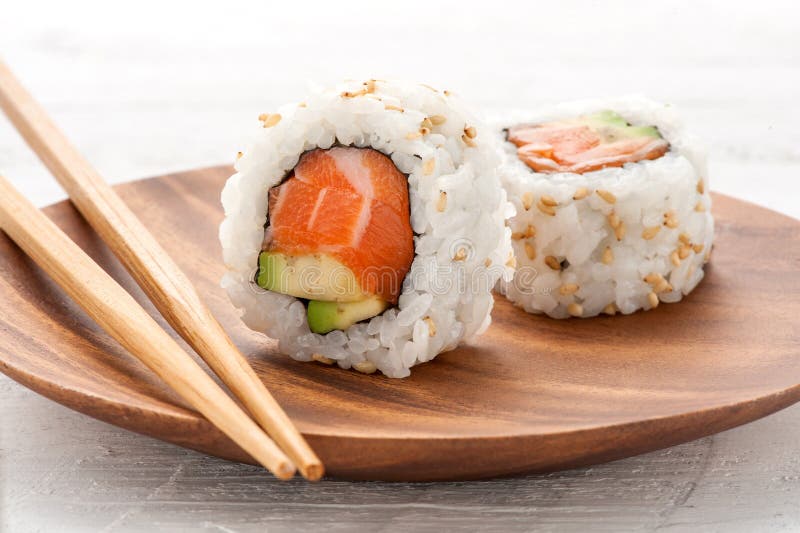 Two fresh salmon and avocado sushi uramaki