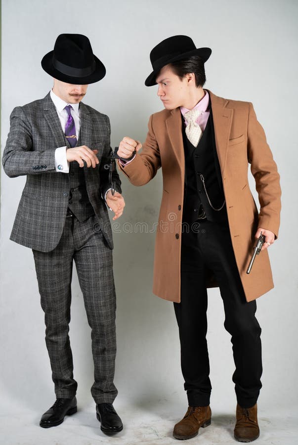 Two Friends Dressed in Vintage Clothes and Depict Retro Detectives and  Spies in English Classic Style on a White Studio Background Stock Image -  Image of detective, guys: 142919901