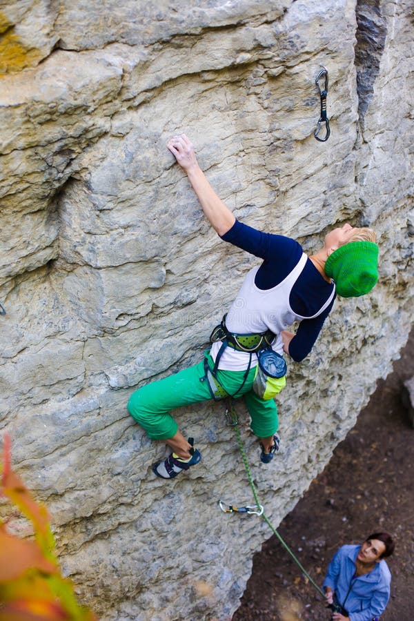 Two Friends Have Been Climbing on the Rocks. Stock Photo Image of