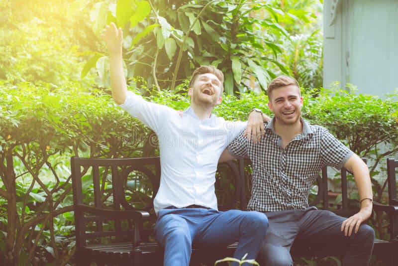 Two Friends Men Talking Standing In A Garden Stock Image Image Of