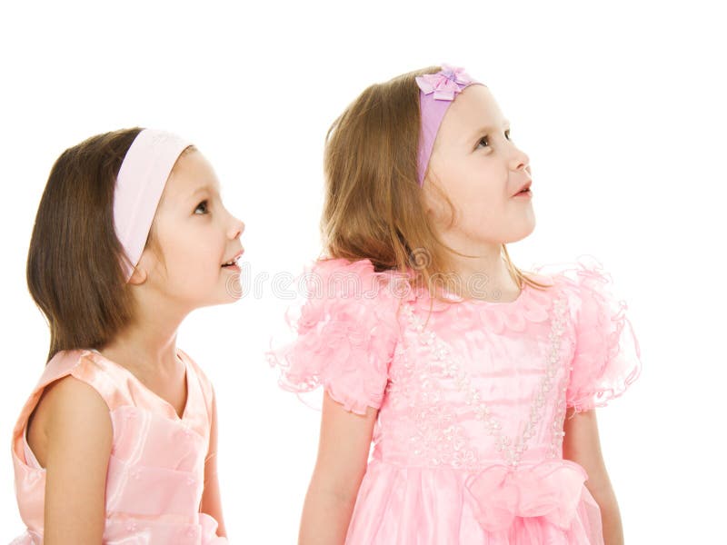 Two friends in a pink dress looking up