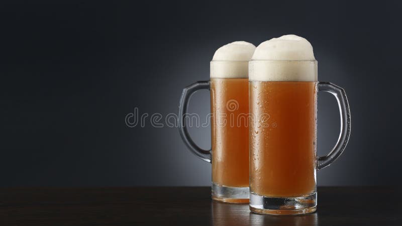 Two Frosty Mugs of Beer on Gradient Gray Stock Photo - Image of glass