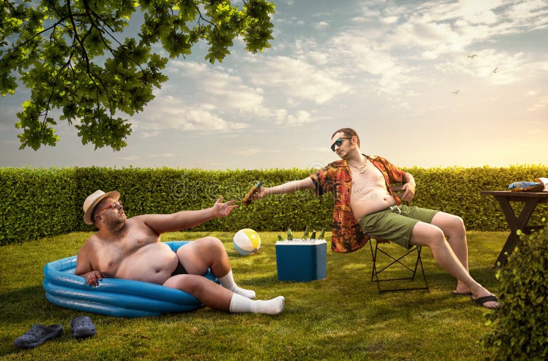 Two funny nerds relaxing in the backyard. On the summer day stock photography