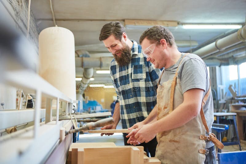Two Furniture Makers with Wooden Furniture Workpiece Stock Photo