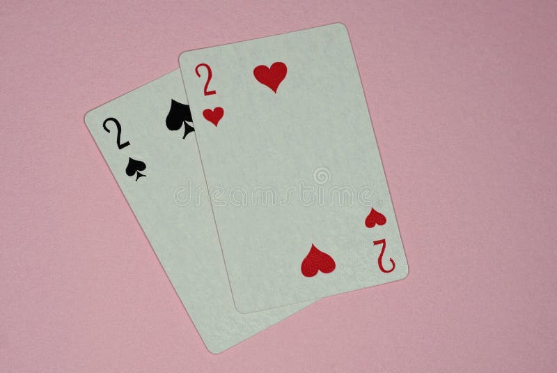 two game cards deuces two game cards deuces lie pink table 232900333