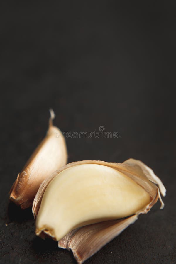 Two Garlic Cloves on Old Dark Backgound Stock Photo Image of asian