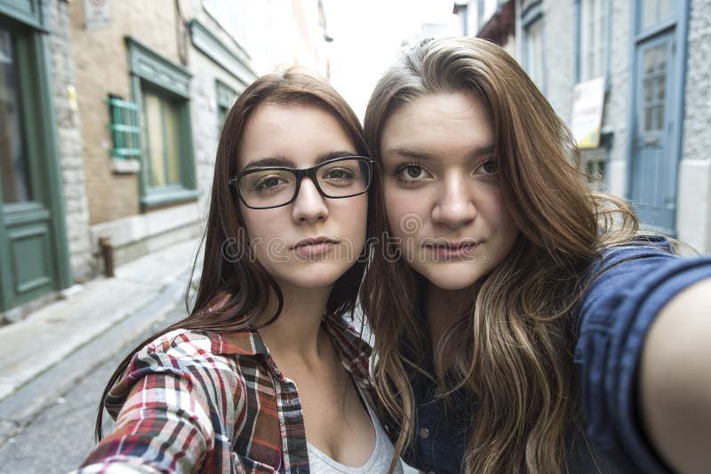 Two Girl Friends In The City Taking Selfie Stock Photo Two Girl Friends In The City Taking Selfie Stock Photo