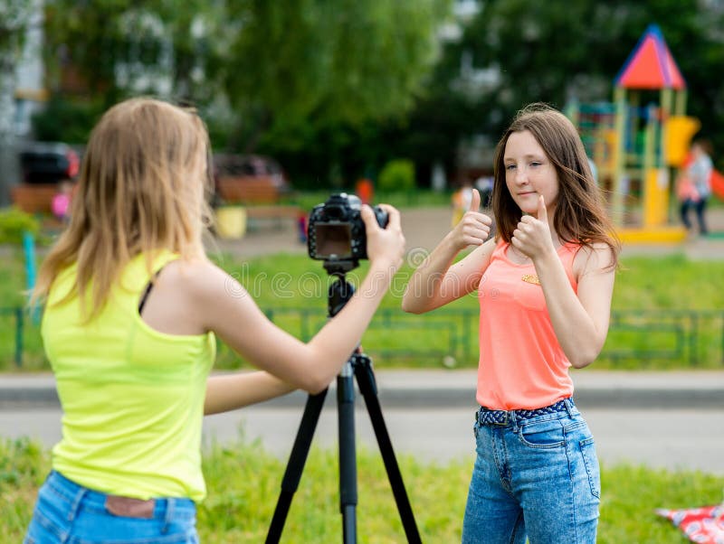 Two Girl Friends Summer In Nature Writes The Video To The Camera Gestures With Hands Showing 