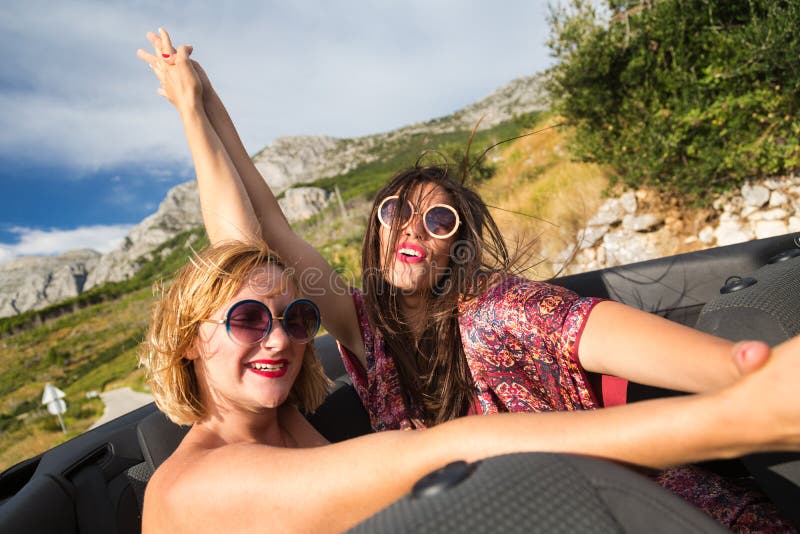 Two Girls At The Back Seat Of A Convertible Car Stock Image Image Of