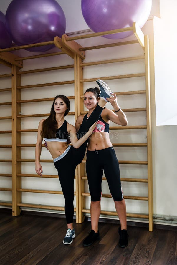 Two girls are doing yoga, aerobics, pilates exercises stock image Two girls are doing yoga, aerobics, pilates exercises stock image