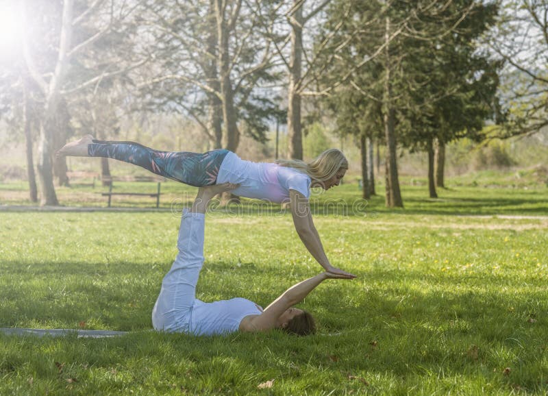 Two girls doing yoga stock image. Image of fresh, relaxation - 90072589