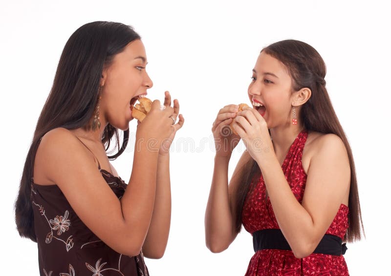 Two girls eating stock image. Image of food, adolescent 4883057