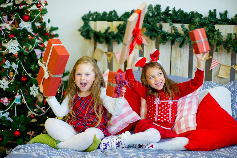 Two Girls Give Christmas Gifts Stock Image - Image of magical, open ...