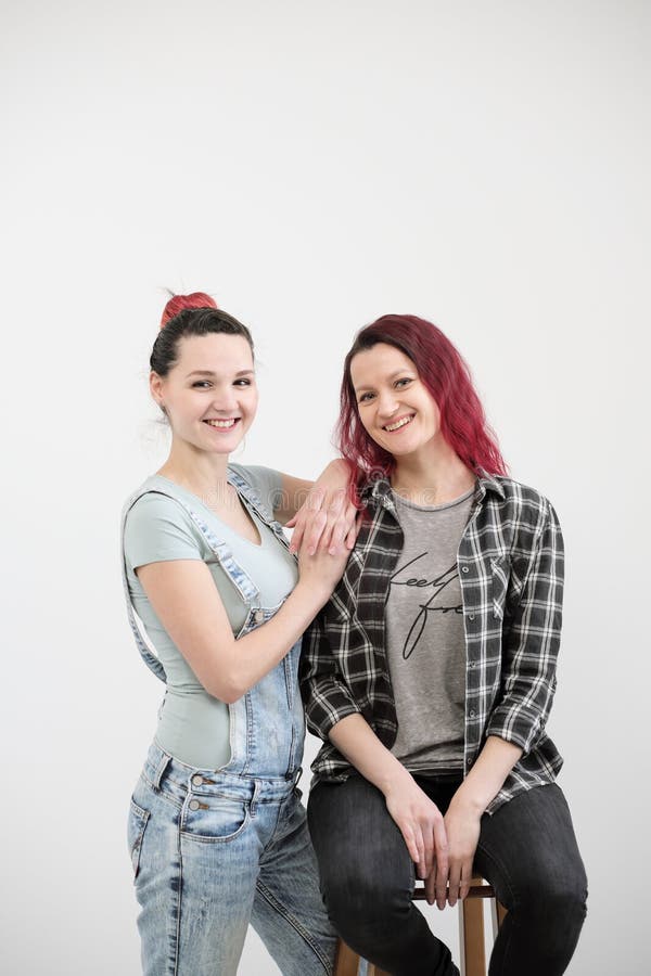 Two Girls Hug on a White Background picture