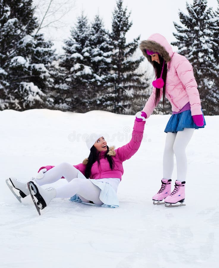 Two girls ice skating stock photo. Image of girl, outdoor 12052488