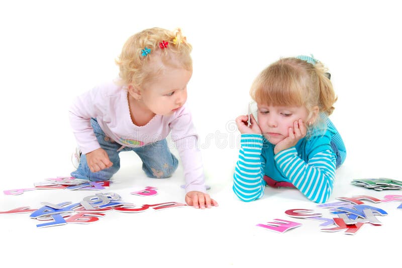 Two girls playing with colorful letters