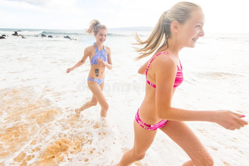 Two female teenagers in bikinis on the beach Stock Photo by ©photography33  7374732
