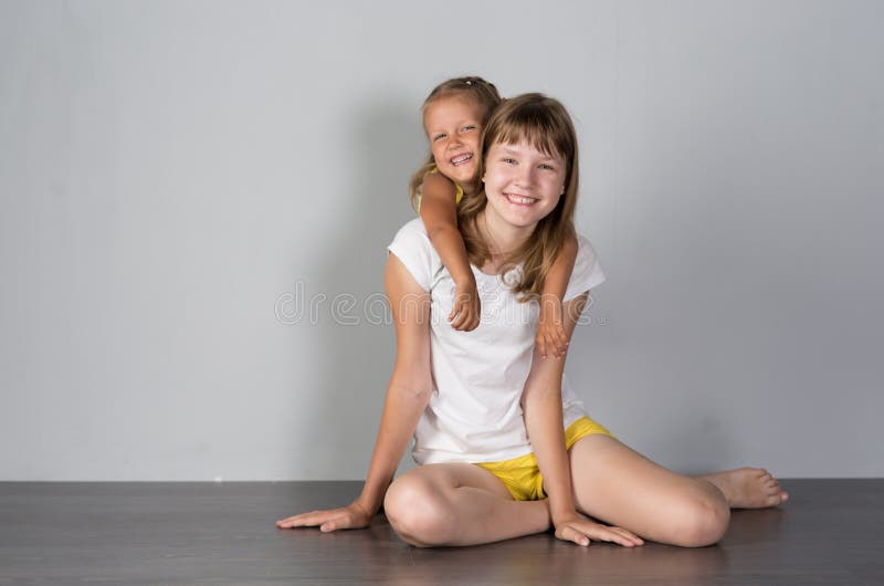 Two girls sisters teenager and child