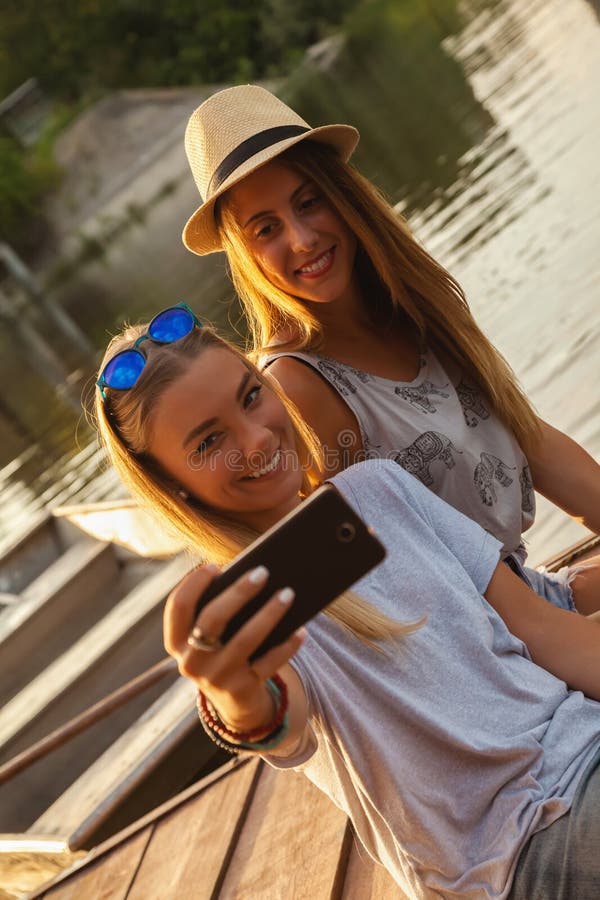 Two Girls Taking Selfie Near River Stock Image Image Of Relaxation 