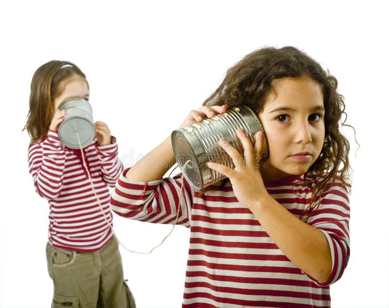 Two girls talking on a tin phone royalty free stock image